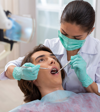 Teenage boy getting a dental exam