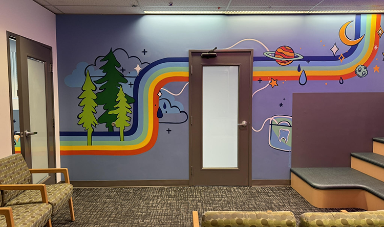 Wall of pediatric dental office with painted rainbow stripe