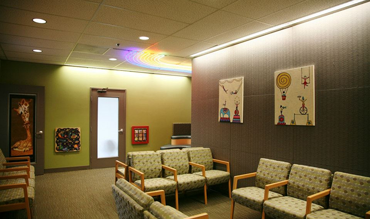 Waiting area with rainbow lights on the ceiling