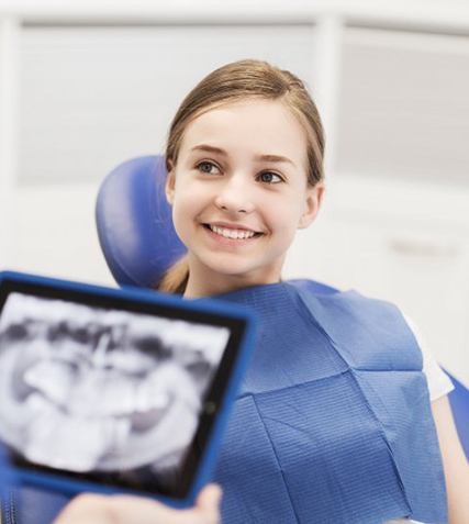 Young girl smiling at the dentist’s office