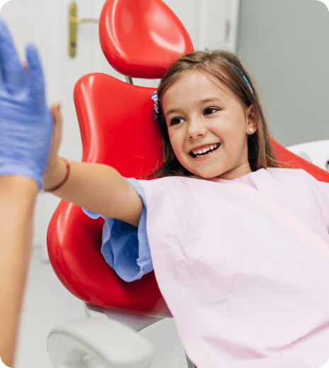 photo of smiling team member with child patient