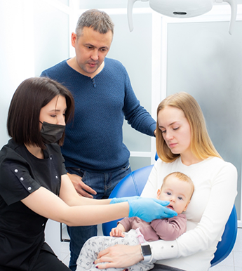 Infant receiving a dental exam