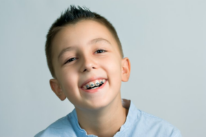 Child smiling with braces